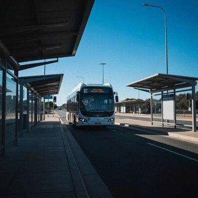Modern bus stop in Adelaide with a bus arriving, clear blue sky, clean image, no text, no words